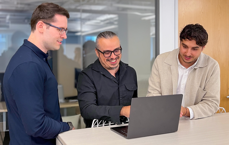 Accredited Debt Relief engineers collaborating on the client platform